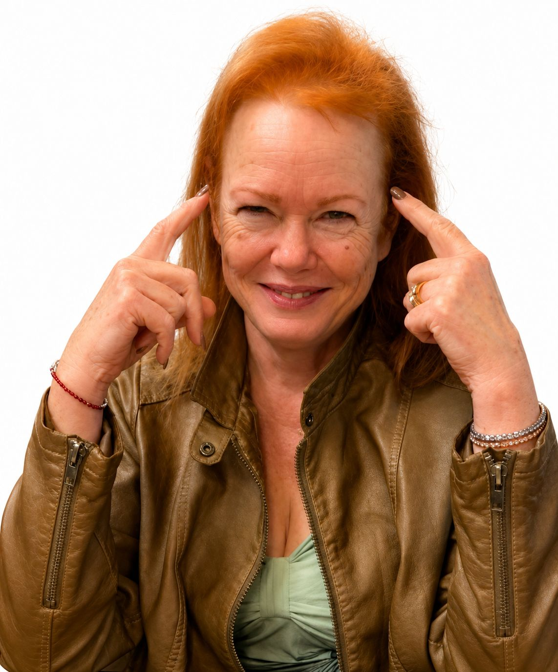 Sandy smiling with her hands beside her face